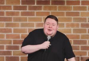 Tony Carroll has been a standout in the comedy scene since 2010, earning a reputation as a crowd and comedian favourite. As a regular headline act at the Hot Water Comedy Club, Tony delivers performances that are both likable and unpredictably brilliant. His natural charisma and quick wit make him a hit with audiences every time. Beyond the stage, Tony co-hosts the hugely successful Hot Water’s Green Room Podcast, where his humour and insights continue to captivate listeners. "Funniest man I know" Says: Paul Smith 